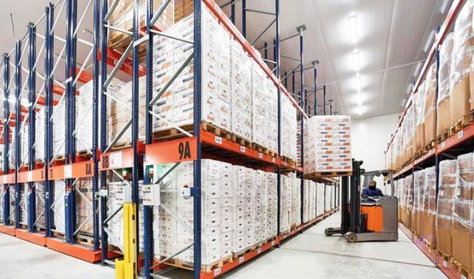 Clinical supply warehouse with organized storage racks